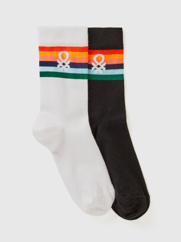 Two pairs of long socks with logos